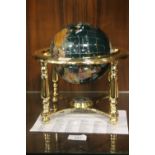 A BRASS BASED LAPIS SEMI PRECIOUS GEMSTONE GLOBE OF THE WORLD WITH CERTIFICATE OF AUTHENTICITY