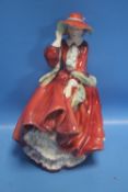 A ROYAL DOULTON FIGURINE "TOP O' THE HILL"