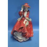 A ROYAL DOULTON FIGURINE "TOP O' THE HILL"