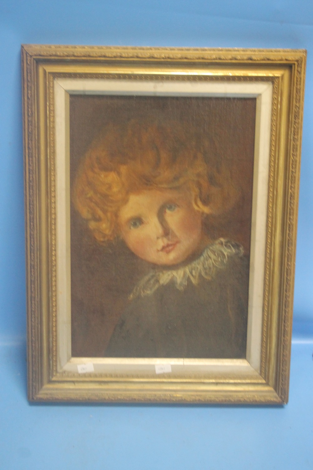 AN ANTIQUE OIL ON BOARD OF A CHILD 36 CM X 47 CM