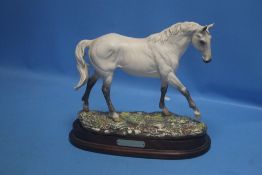 A LARGE LIMITED EDITION ROYAL DOULTON FIGURE OF DESERT ORCHID ON A WOODEN PLINTH WITH CERTIFICATE, H