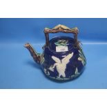 A 19TH CENTURY MAJOLICA TEAPOT DECORATED WITH A WHITE BIRD AND BULL RUSHES