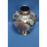 AN UNUSUAL ENAMEL AND WHITE METAL MOUNTED VASE, DECORATED WITH BIRDS AND FLOWERS