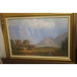 A GILT FRAMED OIL ON CANVAS OF A SOUTH AFRICAN MOUNTAIN SCENE SIGNED BY CASEY VAN DER LEEK 113 CM