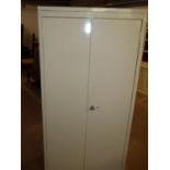 A STRONG STEEL TWO DOOR SHELVED STORAGE CABINET