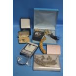 A BOX OF COSTUME JEWELLERY TO INCLUDE NECKLACES, EARRINGS, BROOCHES, BANGLES ETC.
