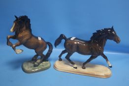 A PAIR OF BESWICK HORSES, ONE TROTTING AND ONE REARING (2)