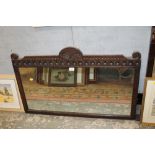 AN ANTIQUE OAK FRAMED HANGING MIRROR W 99 CM