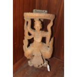 AN INDONESIAN CARVED HARDWOOD FIGURAL WALL HANGING, the figure in traditional dress, H 41 cm