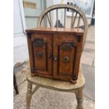 A LATE VICTORIAN NOVELTY OAK TABLE CABINET IN THE FORM OF AN IRON SAFE WITH BRASS FITTINGS, THE