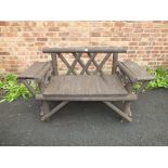 A WOODEN GARDEN BENCH S/D