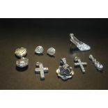 A COLLECTION OF SILVER PENDANTS ETC TO INCLUDE A HEART SHAPED LOCKET