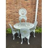 A GREY CAST ALUMINIUM GARDEN TABLE AND FOUR CHAIRS A/F - TABLE LEG BROKEN