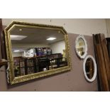 A MODERN GILT WALL MIRROR - 73 X 103 CM, WITH THREE WHITE WALL MIRRORS (4)