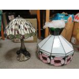 A TIFFANY STYLE LAMP TOGETHER WITH A LARGER TIFFANY STYLE LEADED GLASS SHADE