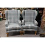 A PAIR OF MODERN BLUE CHECKED WINGBACK ARMCHAIRS