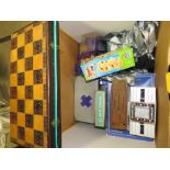 A LARGE BOX OF GAMES TO INCLUDE A WOODEN CHESS SET, RUBIX CUBE ETC