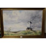 RICHARD BIRD - A FRAMED OIL ON CANVAS DEPICTING A COASTAL WINDMILL 49.5 X 75 CM