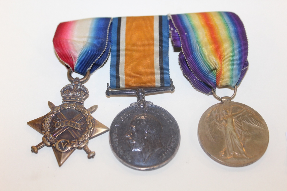 A BAR OF THREE WWI MEDALS AWARDED TO 50611 GNR V P DAVIES R.G.A
