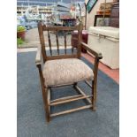 A CHILDS SHERATON STYLE STAINED BEECH CHAIR WITH SEVEN STRETCHERS