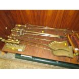 A COLLECTION OF BRASS FIRE IRONS ETC