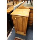 AN EDWARDIAN OAK POT CUPBOARD S/D