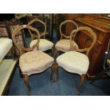 A SET OF FOUR VICTORIAN CROWNBACK DINING CHAIRS