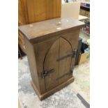 A SMALL GOTHIC STYLE CUPBOARD WITH HEAVY CAST FURNITURE - H 92 CM, W 61 CM