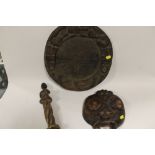 A WEST AFRICAN NIGERIAN STYLE YORUBA DIVINATION BOARD, YORUBA POT LID WITH CARVED MASKS AND YORUBA