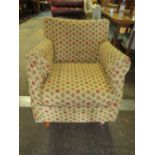 A MODERN UPHOLSTERED ARMCHAIR WITH LOOSE COVERS