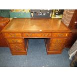AN EARLY 20TH CENTURY LEATHER TOP TWIN PEDESTAL DESK H-77 W-136 CM D-76 CM