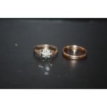 A 9 CARAT GOLD DIAMOND CLUSTER RING APPROX WEIGHT 1.5G, TOGETHER WITH AN 18CT GOLD WEDDING BAND