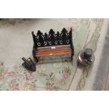 A CAST IRON MINIATURE GARDEN BENCH, TOGETHER WITH A VINTAGE FLAT IRON AND AN OIL LAMP (3)