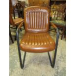 A RETRO STYLE BROWN LEATHER ARMCHAIR