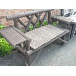 A RUSTIC SCRATCH BUILT GARDEN BENCH SEAT