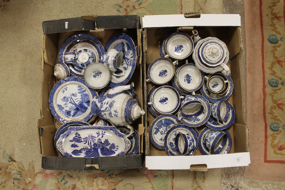 TWO TRAYS OF BLUE AND WHITE WILLOW PATTERN CHINA TO INCLUDE TEA AND COFFEE POTS