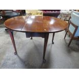 A 19TH CENTURY DROPLEAF TABLE ON CABRIOLE SUPPORTS
