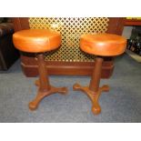 A PAIR OF CAST UPHOLSTERED ADJUSTABLE SINGER STOOLS H-55 CM (2)