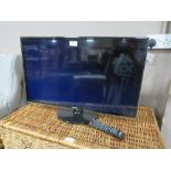 A SAMSUNG 31" FLATSCREEN TV - REMOTE