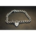 A VINTAGE STERLING SILVER BRACELET WITH HEART LOCK