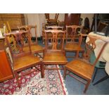 A SET OF SIX 19TH CENTURY OAK CHIPPENDALE STYLE COUNTRY CHAIRS