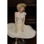 A CERAMIC FIGURE OF MARILYN MONROE ON STAND - H 43 CM
