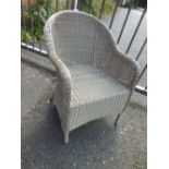 A RATTAN GARDEN CHAIR