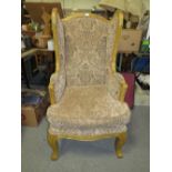 A MODERN LOUIS XV STYLE UPHOLSTERED WING ARMCHAIR