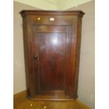 A 19TH CENTURY OAK HANGING CORNER CUPBOARD