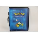 A POKEMON ZIP BINDER TRADING CARD HOLDER CONTAINING 8 POKEMON 2000 CARDS AND 9 HOLOGRAPHIC SERIES