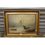A PAIR OF GILT FRAMED OIL ON CANVAS OF COASTAL SCENES WITH MOORED BOATS SIGNED J H HEWITT, 1921 -