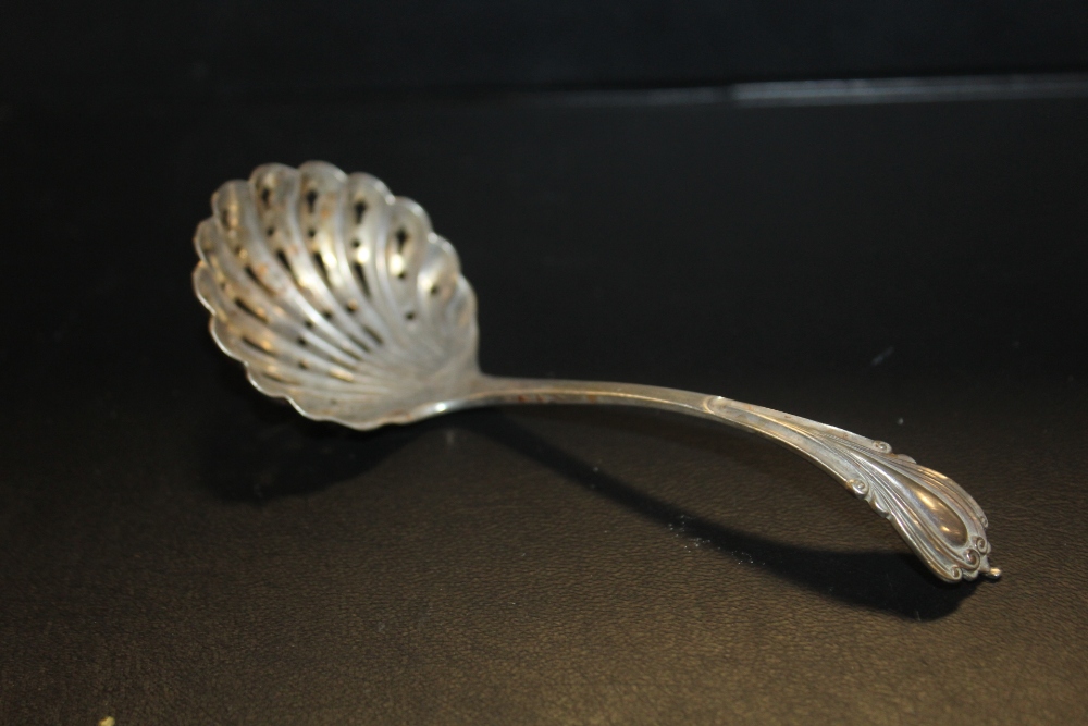 A HALLMARKED SILVER SIFTER SPOON