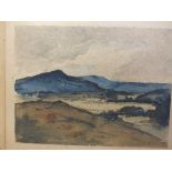 AN UNFRAMED WATERCOLOUR OF A MOUNTAINOUS LANDSCAPE INDISTINCTLY SIGNED LOWER RIGHT IN PENCIL -