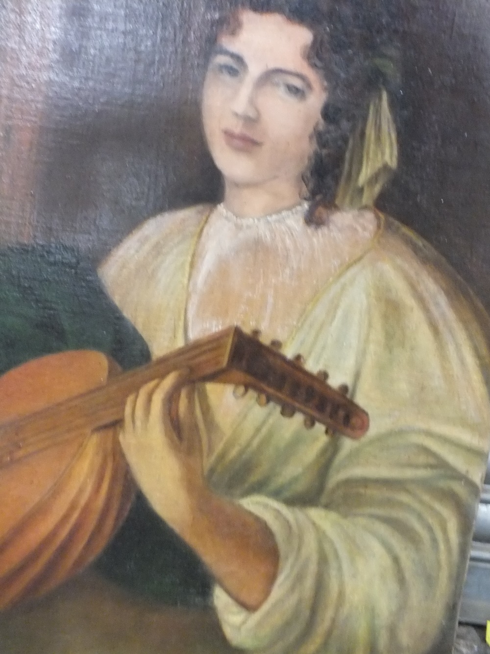 A 19TH CENTURY OIL ON CANVAS LAID ON BOARD OF A FEMALE FIGURE PLAYING A LUTE 71CM X 60CM